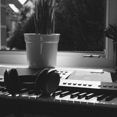Sunlight streaming through a window into an empty studio space.